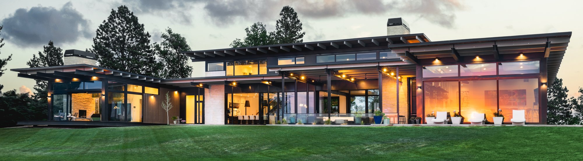 Custom home rear exterior at dusk