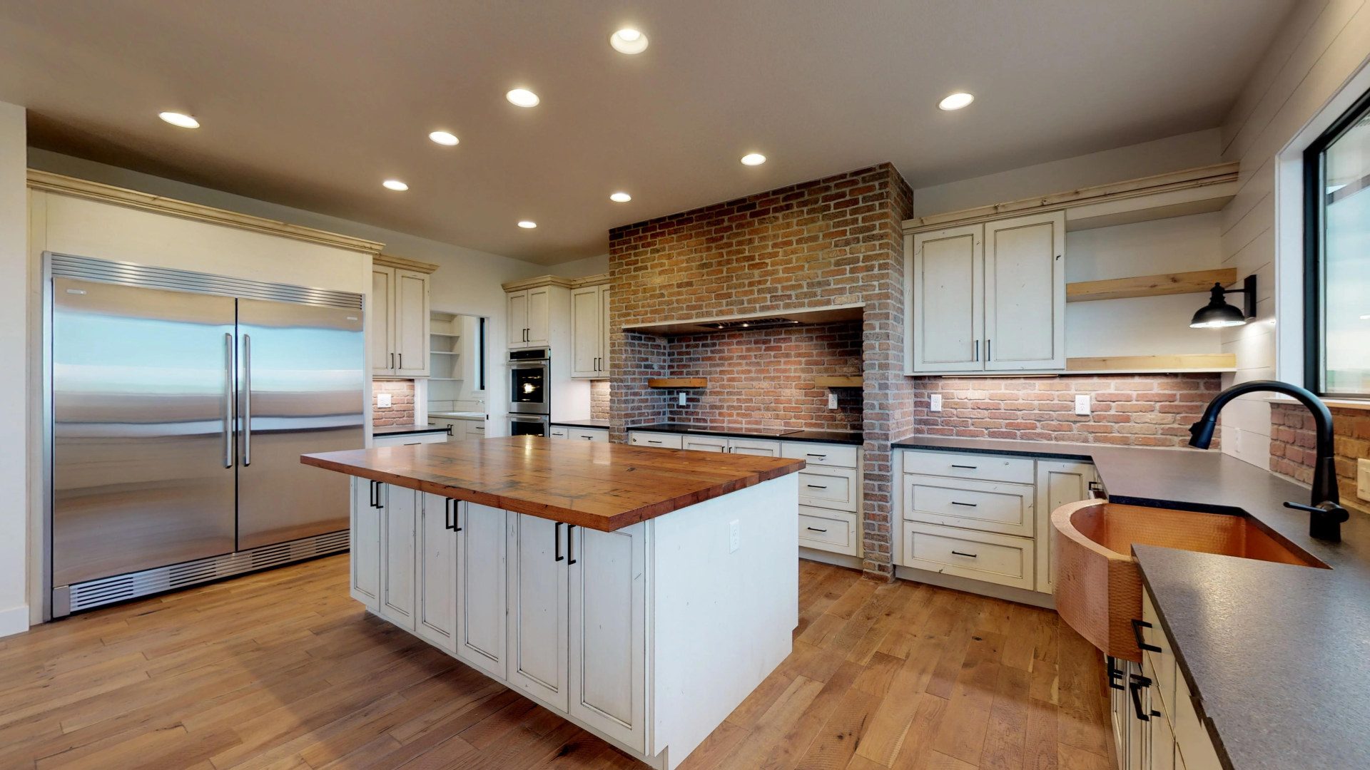 Custom kitchen with brick surround